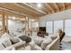 Partially finished basement with concrete floors, comfortable seating, and natural light at 4355 Old Hamilton Mill Rd, Buford, GA 30518
