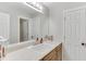 Bathroom featuring a long countertop with a single sink and vanity and multiple doors at 4355 Old Hamilton Mill Rd, Buford, GA 30518