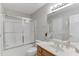 Bathroom featuring a shower-tub combination with sliding doors and a single sink vanity at 4355 Old Hamilton Mill Rd, Buford, GA 30518
