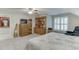 Bright, carpeted bedroom with a ceiling fan, built in cabinet and storage and ample natural lighting at 4355 Old Hamilton Mill Rd, Buford, GA 30518