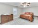 Finished bedroom with carpet flooring, ceiling fan and a dresser at 4355 Old Hamilton Mill Rd, Buford, GA 30518