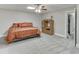 Finished bedroom with carpet flooring, ceiling fan and a wardrobe at 4355 Old Hamilton Mill Rd, Buford, GA 30518