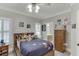 Charming bedroom with fun space-themed decor and plush bedding, with a view to the en-suite bath at 4355 Old Hamilton Mill Rd, Buford, GA 30518