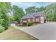 Exterior home view with a driveway and a lawn at 4355 Old Hamilton Mill Rd, Buford, GA 30518