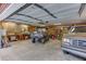 Garage interior with vehicles, shelving, and workspace at 4355 Old Hamilton Mill Rd, Buford, GA 30518