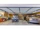 Open garage with vehicles, shelving, and workspace at 4355 Old Hamilton Mill Rd, Buford, GA 30518