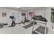 A home gym featuring rubber mats, workout equipment, and motivational decor at 4355 Old Hamilton Mill Rd, Buford, GA 30518