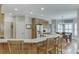 Spacious kitchen with a large island, stainless steel appliances, hardwood floors and adjacent breakfast nook at 4355 Old Hamilton Mill Rd, Buford, GA 30518