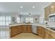 Expansive kitchen with custom cabinets, granite countertops, stainless steel appliances and hardwood floors at 4355 Old Hamilton Mill Rd, Buford, GA 30518