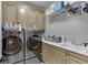 A well-equipped laundry room with modern appliances and ample storage space at 4355 Old Hamilton Mill Rd, Buford, GA 30518