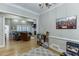 Comfortable living room with hardwood floors, grey sofa and an adjacent open doorway at 4355 Old Hamilton Mill Rd, Buford, GA 30518