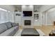 Elegant living room with a cozy fireplace, built-in shelving and a hardwood floor at 4355 Old Hamilton Mill Rd, Buford, GA 30518