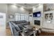 Spacious living room featuring hardwood floors, fireplace, built-ins and ample natural light at 4355 Old Hamilton Mill Rd, Buford, GA 30518