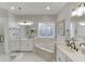 Elegant bathroom with soaking tub, glass shower, and double vanity at 4355 Old Hamilton Mill Rd, Buford, GA 30518