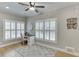 Well-lit office space with hardwood floors, shuttered windows, and a stylish area rug at 4355 Old Hamilton Mill Rd, Buford, GA 30518