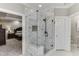 Modern tiled shower with glass enclosure, showcasing contemporary design and fixtures next to a bedroom at 4355 Old Hamilton Mill Rd, Buford, GA 30518