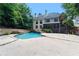 Backyard view with a pool, landscaping, and the rear exterior of the house at 4567 Brigade Ne Ct, Roswell, GA 30075