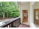 Balcony overlooking a pool area, and a view into the home interior through an open door at 4567 Brigade Ne Ct, Roswell, GA 30075
