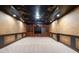 Finished basement with a custom ceiling design, recessed lighting, and ample space for various activities at 4567 Brigade Ne Ct, Roswell, GA 30075