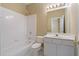 Well-lit bathroom with white tile and vanity at 4567 Brigade Ne Ct, Roswell, GA 30075
