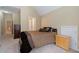 Bedroom featuring neutral walls, a bed, and a dresser at 4567 Brigade Ne Ct, Roswell, GA 30075