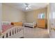 Neutral bedroom features two beds with wooden frames, carpet flooring, wooden dressers, and natural light at 4567 Brigade Ne Ct, Roswell, GA 30075