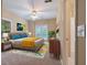 Bright bedroom featuring a ceiling fan, natural light, and an ensuite bathroom at 4567 Brigade Ne Ct, Roswell, GA 30075