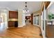 Dining area with hardwood floors, classic light fixture, and natural light from backyard access at 4567 Brigade Ne Ct, Roswell, GA 30075