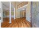 A spacious entryway with hardwood floors, columns, and a chandelier at 4567 Brigade Ne Ct, Roswell, GA 30075