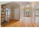 Foyer with hardwood floors, staircase, and a decorative front door, illuminated by a chandelier at 4567 Brigade Ne Ct, Roswell, GA 30075