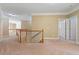 Upstairs hallway with neutral paint and carpet, plus traditional wood and white banister at 4567 Brigade Ne Ct, Roswell, GA 30075
