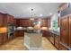 Gourmet kitchen with custom cabinets, granite countertops, stainless steel appliances and hardwood floors at 4567 Brigade Ne Ct, Roswell, GA 30075