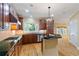 Well-equipped kitchen featuring wooden cabinetry, granite countertops, stainless steel appliances, and decorative lighting at 4567 Brigade Ne Ct, Roswell, GA 30075