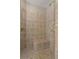 Bathroom with tile shower with seating, and dual shower heads at 4567 Brigade Ne Ct, Roswell, GA 30075