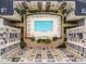Close aerial view of a luxury condo featuring an outdoor swimming pool with lounge chairs at 711 Cosmopolitan Ne Dr # 300, Atlanta, GA 30324