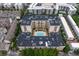 Overhead of condo featuring an outdoor swimming pool with lounge chairs in a courtyard setting at 711 Cosmopolitan Ne Dr # 300, Atlanta, GA 30324
