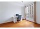 Bright bedroom with hardwood floors, desk, and a large window with lots of natural light at 711 Cosmopolitan Ne Dr # 300, Atlanta, GA 30324