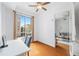 Bright bedroom with hardwood floors and a large window with exterior view at 711 Cosmopolitan Ne Dr # 300, Atlanta, GA 30324