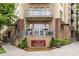Exterior of a residential condo showcasing multiple stories with brick and tan accents at 711 Cosmopolitan Ne Dr # 300, Atlanta, GA 30324