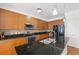 Modern kitchen features stainless steel appliances, dark countertops and wooden cabinets at 711 Cosmopolitan Ne Dr # 300, Atlanta, GA 30324
