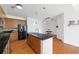 Modern kitchen features stainless steel appliances, dark countertops and wooden cabinets at 711 Cosmopolitan Ne Dr # 300, Atlanta, GA 30324
