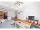 Bright living room with comfortable sofa, hardwood floors, and an open concept kitchen at 711 Cosmopolitan Ne Dr # 300, Atlanta, GA 30324