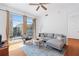 Bright living room featuring comfortable sofa, hardwood floors, and balcony access at 711 Cosmopolitan Ne Dr # 300, Atlanta, GA 30324