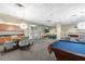 Community lounge area featuring a kitchenette, billiards table, and modern seating at 711 Cosmopolitan Ne Dr # 300, Atlanta, GA 30324