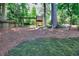 Spacious backyard features a playground set and a lush grassy area perfect for outdoor activities at 1935 Shrader Ct, Lawrenceville, GA 30044