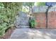 Outdoor basketball court framed by stone stairs and greenery with a basketball hoop for recreational activities at 1935 Shrader Ct, Lawrenceville, GA 30044