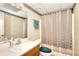 Bathroom featuring a vanity with a sink, a toilet, and a shower with a curtain at 1935 Shrader Ct, Lawrenceville, GA 30044