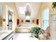 Relaxing bathroom with soaking tub, a skylight, and a vanity at 1935 Shrader Ct, Lawrenceville, GA 30044