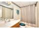 Bathroom features a combination shower and tub, sink and vanity at 1935 Shrader Ct, Lawrenceville, GA 30044