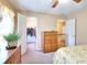 Bedroom featuring a closet, wooden dresser, and a view of the stairs at 1935 Shrader Ct, Lawrenceville, GA 30044